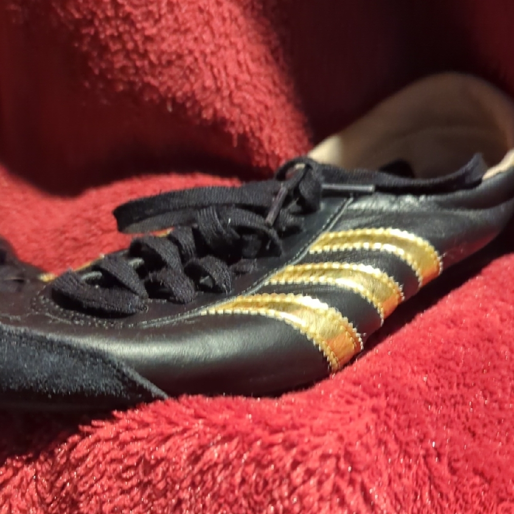 Adidas Women's Black Athletic Shoes with Gold Stripes
